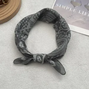 Macro view of grey Egyptian print cotton headscarf with ethnic pattern details