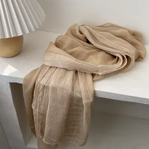 Detail of gradient pleated long scarf in champagne blend fabric for women's elegant styling