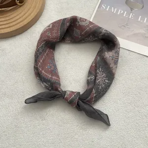 Detail of vintage bohemian headscarf featuring ethnic patterns on soft linen fabric