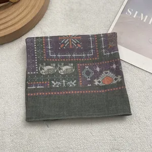 Detailed macro shot of vintage bohemian scarf with ethnic elephant patterns on cotton linen