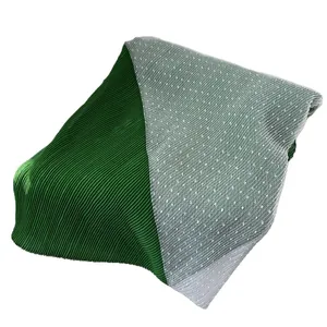 Long pleated green scarf with white polka dot mesh detail and gradient color blend