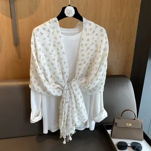 Elegant white cotton scarf for women with brown heart prints and tassel ball accents