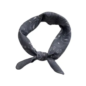 Dark grey paisley cotton neckerchief featuring a classic bandana print and tied knot style