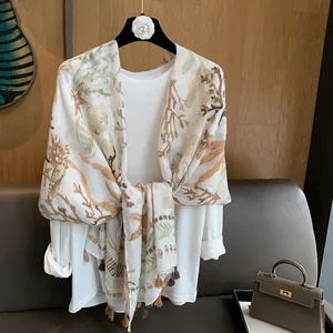 White linen shawl with coral and starfish prints and elegant tassels for beach vacation