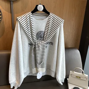 Detail view of gray Northwestern University sweatshirt with striped knit shawl accent
