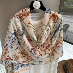 Detail of coral and starfish print on lightweight cotton-linen summer beach shawl
