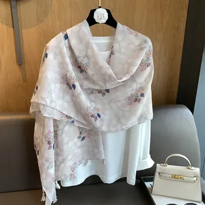 Detail of floral linen shawl with berry print and delicate fringe edges decoration