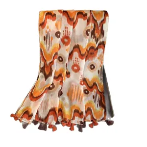 Ethnic style cotton linen scarf with orange ikat tie-dye pattern and fine tassels