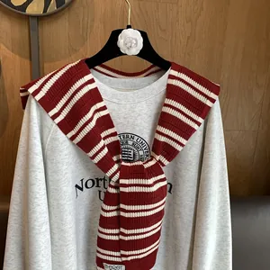 Red and white striped knitted shawl wrap accessory with knotted tie and ribbed edge design