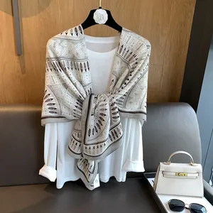 Elegant beige vintage ethnic print scarf for women worn as a stylish shawl wrap