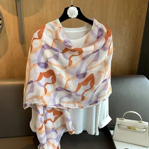 Elegant lightweight floral print scarf with abstract purple and orange geometric patterns