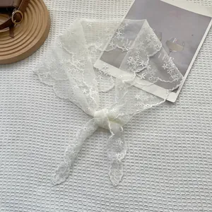 Elegant white lace triangle scarf with floral embroidery and wavy scalloped edges
