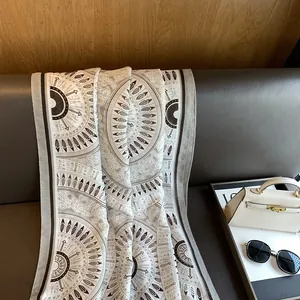 Detail of bohemian mandala print scarf showing high-quality fabric and texture