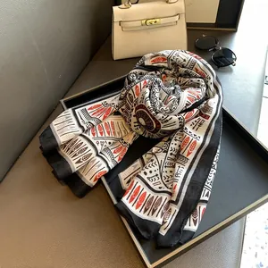Detailed macro view of retro ethnic feather print scarf with fine stitched edges