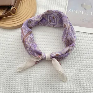 Detail of lavender cotton linen scarf with baroque floral print and wavy edge finish