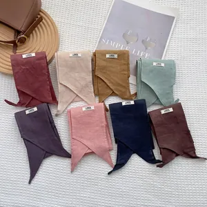 8-color handmade linen long scarves collection displayed on a waffle fabric background