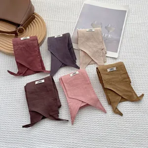 Handmade pure linen scarves in six natural colors on a cozy home aesthetic background