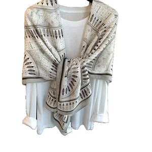 Ethnic print scarf for women with feather and geometric patterns in soft beige and grey
