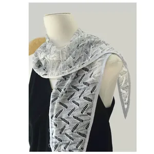 Detail of light gray lace cooling scarf showing hollow geometric pattern on mannequin