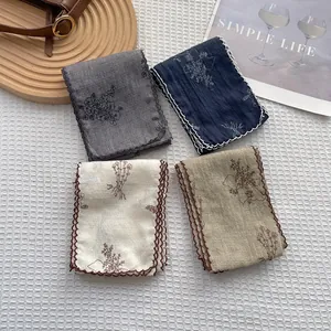 Set of four cotton linen scarves with floral embroidery and scalloped edges