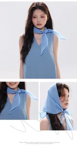 Detail of light blue silk scarf worn as a neckerchief and headscarf with matching dress