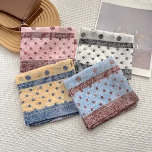 Chic paisley and polka dot square scarves in pink, white, yellow, and light blue