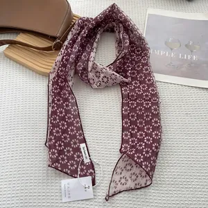Burgundy floral skinny silk scarf displayed elegantly on a white textured background