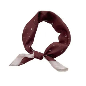 Burgundy heart pattern silk scarf tied in a stylish knot on a clean white background
