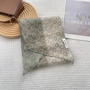 Elegant patchwork floral skinny scarf in bean green and cream white with delicate patterns