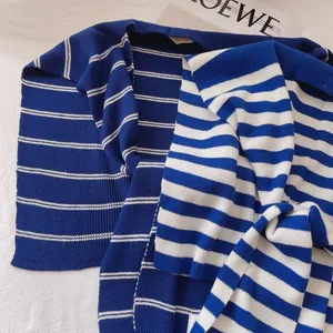 Blue and white striped knit shawl with a knot design in a chic nautical style