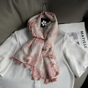 Elegant pink and white lightweight scarf with gold foil accents and fringe tassels