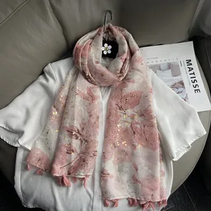 Elegant pale pink linen scarf with floral gold foil pattern and tassels for women