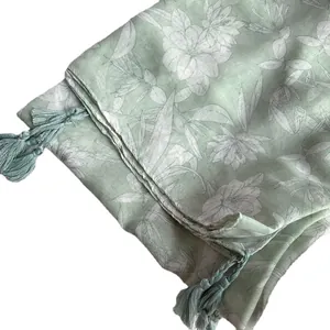 Light green cotton linen scarf with white floral print and tassel edges for sun protection