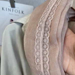 Detailed close-up of pink lace cotton scarf showing transparent mesh and floral embroidery