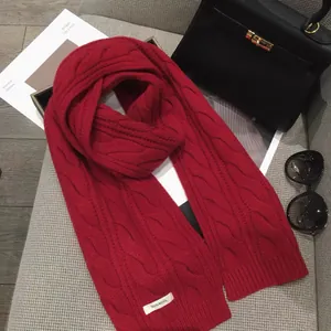 Luxurious red 100% wool cable knit scarf for women with festive winter vibes
