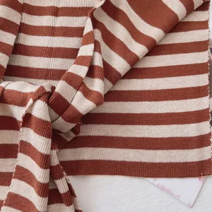 Macro detail of classic brown and cream striped knit fabric with rib texture