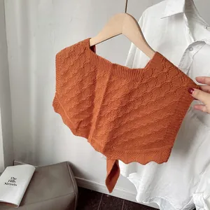 Burnt orange knit shawl with hollow crochet pattern and scalloped edges for women