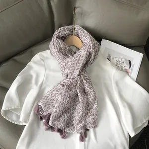Elegant women's white beach shawl with golden wheat patterns and fringe trim