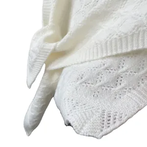 White pointelle knit shawl with hollow diamond patterns and ribbed edges for women