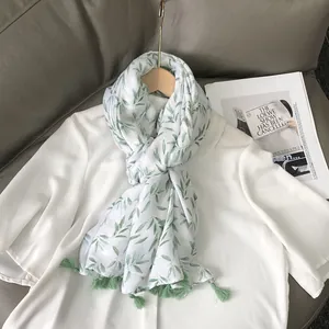 Elegant white linen scarf with green leaf print and tassels for women's spring fashion