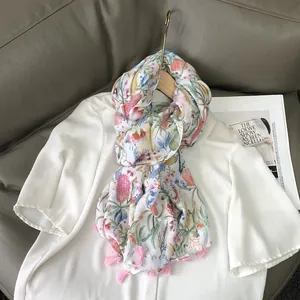 Floral cotton linen scarf with pink tassels and botanical prints for sun protection