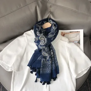 Navy blue paisley print Bali yarn scarf with white geometric patterns and tassel details