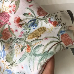 Detailed close-up of floral linen shawl fabric texture with Banksia patterns