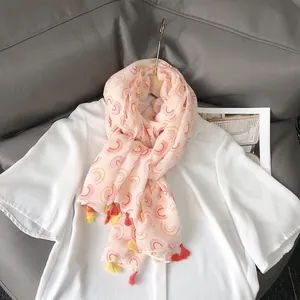 Lightweight pink cotton linen scarf with colorful rainbow print and fringe tassels