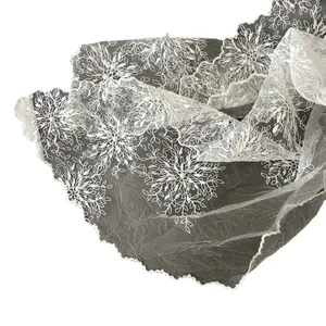 Elegant white lace scarf with embroidered floral patterns and small pearl accents