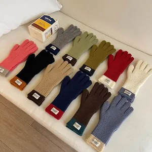 Detailed knit gloves collection with ribbed cuffs and unique Somewhere Surprise label