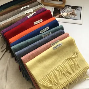 Macro shot of 100% Australian wool scarves with soft fringe edges in vibrant colors