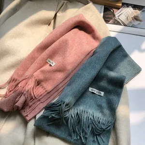 Detailed macro of 100% Australian wool scarf with long tassels and soft brushed texture