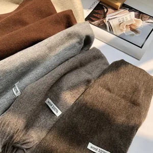 100% Australian wool scarf with long tassels in earthy tones for winter warmth