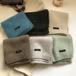 Set of six colorful 100% wool knitted scarves with ribbed edges for winter warmth